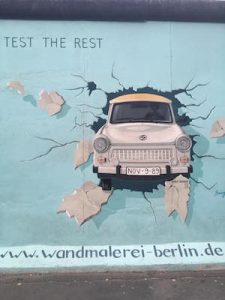 Car Breaking Through the Wall at the East Side Gallery