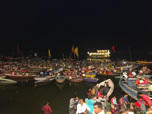 People attending the Ganga Aarti ceremony at Dashashwamedh Ghat from the boats