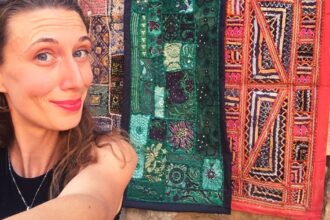 Planning a trip to India: selfie with colorful carpets in Jaisalmer Fort