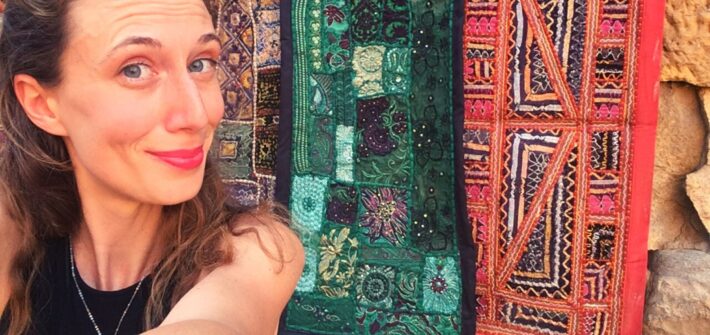 Planning a trip to India: selfie with colorful carpets in Jaisalmer Fort