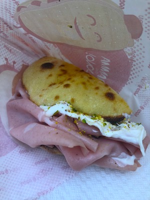 Puccia with mortadella and stracciatella in Polignano a Mare, one stop of our food and wine tour of Italy
