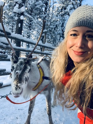 Selfie with a reindeer during a reindeer safari